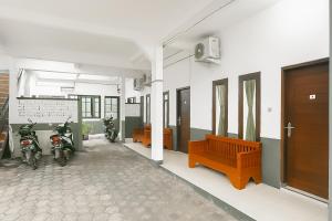 a room with two motorcycles parked in a building at Hotel Saluyu by Inara Pangandaran Mitra RedDoorz in Pangandaran
