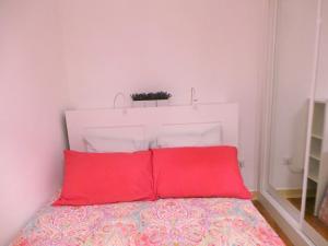 מיטה או מיטות בחדר ב-Barracão de Alfama Apartments