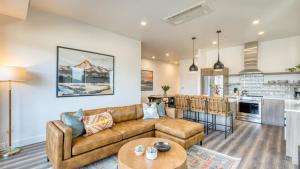 a living room with a couch and a kitchen at 1119 Aerie Buyout 2 Units Near Old Bend Hot Tub Mountain View in Bend