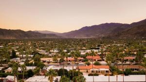 a town in the middle of a valley with mountains at 3 Private Rooms At The Wesley Hotel Perfect for Group Stays in Palm Springs