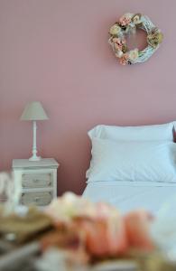 A bed or beds in a room at Locanda