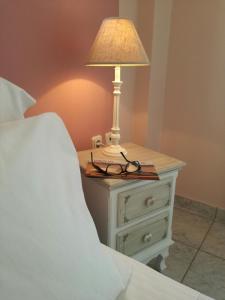 A bed or beds in a room at Locanda