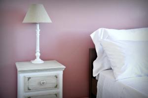 A bed or beds in a room at Locanda
