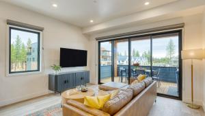 a living room with a couch and a flat screen tv at 2 Units Minutes to Old Bend Deck Hot Tub 1216 Skyline Ranch by AvantStay in Bend