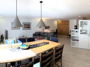 a kitchen and living room with a table and chairs at Hiltrup Stübchen in Amelsbüren