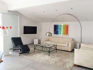a living room with a couch and a table at Holiday apartment in Tisno with swimming pool in Tisno