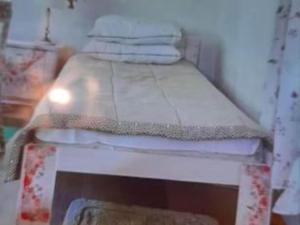 Giường trong phòng chung tại Holiday Home Green Side Cottage - Two Bedroom Holiday Home