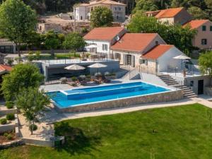 an aerial view of a house with a swimming pool at Villa Casa Di Pietra in Rupići