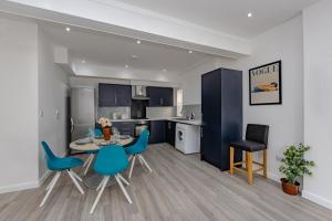 a kitchen and dining room with a table and chairs at Triple B Aparto in Clacton-on-Sea