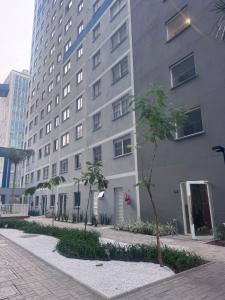 a tall building with a palm tree in front of it at Linkin Home Mapp Rio Branco in Sao Paulo +24 photos