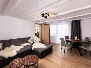 a living room with a couch and a table at Time out at the mountain spring in Mitterbach