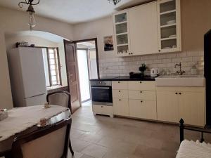 Η κουζίνα ή μικρή κουζίνα στο La Casa Nostra Apartments - Comfort 1 Bedroom Apt