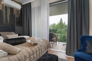 Χώρος καθιστικού στο Holiday studio with balcony, indoor pool, sauna +40 φωτογραφίες