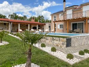 an image of a villa with a swimming pool at Villa Maria with Outdoor Pool - Five Bedroom Villa with Outdoor Pool in Otavice