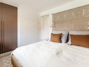 a bedroom with a large white bed with two pillows at Holiday apartment with 2 bedrooms in Oberammergau +31 photos