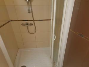 a shower with a glass door in a bathroom at Marina Portoro Family Friendly Apartment 4 - Two Bedroom Apartment in Lucija