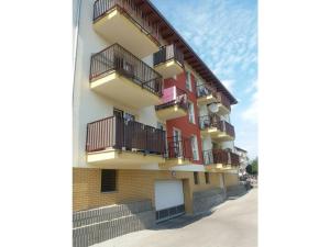 a building with balconies on the side of it at One-bedroom apartment in Czajczyn