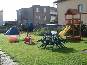 a group of playground equipment in a yard at on the Baltic Sea in Kolobrzeg - Grzybowo in Grzybowo +9 photos