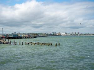 a pier in the water with a city in the background at Orchard House - Uk48580 in Rochford