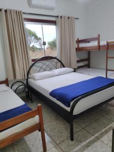 Ένα ή περισσότερα κρεβάτια σε δωμάτιο στο Ana Terra Barretos Casa de Campo