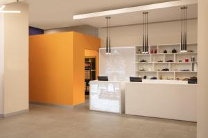 a store with a yellow and white counter in a room at Fiesta Inn Express Monterrey Centro in Monterrey