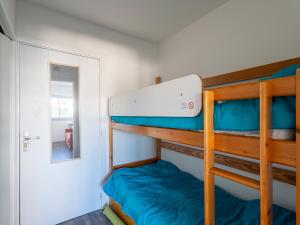a bunk room with two bunk beds and a doorway at Appartement Calme Proche Plage avec Parking Sécurisé et Balcon - Arcachon - FR-1-319-547 in Arcachon