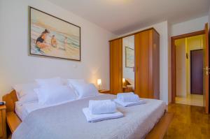 Posteľ alebo postele v izbe v ubytovaní Harmony Apartment