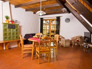 a dining room with a table and chairs at Holiday farm Hohe Drei Zinnen in Hiltpoltstein
