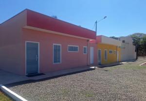 a row of colorful buildings on a street at Flats de 2 quartos in Regente Feijó
