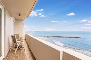 a balcony with a view of the ocean at Fiesta Inn Veracruz Boca Del Rio in Veracruz