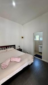 Ένα ή περισσότερα κρεβάτια σε δωμάτιο στο Yadua Bay Holiday Homes +4 φωτογραφίες