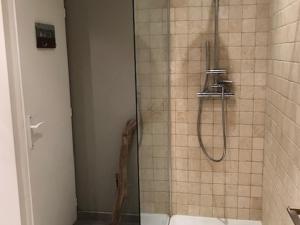a bathroom with a shower with a glass door at Appartement spacieux à Pra-Loup, terrasse sud, 10 pers - FR-1-165A-202 in Pra-Loup