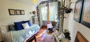 a living room with a couch and a chair at Urban Cottage in Masterton