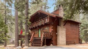 a log cabin in the woods with a deck at Sunnyside by AvantStay Charming Lake Tahoe Chalet on Tahoes West Shore in Tahoe City