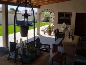a living room with a patio with a table and chairs at One bedroom apartment in Loborika