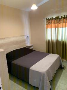 Postel nebo postele na pokoji v ubytování Agosto 23 Centrico