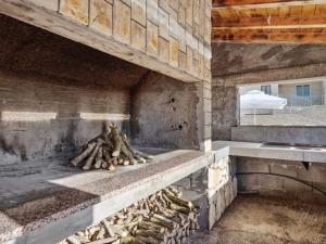 a pile of bananas sitting on a stone ledge at Holiday Home Stari Dvori in Podumci