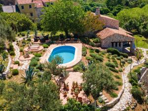 an aerial view of a garden with a swimming pool at Stone House Anfitrite - Two Bedroom Villa with Private Pool and Terrace in Trstenik