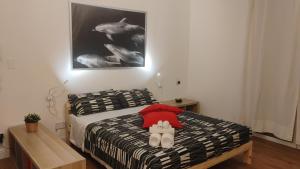 a bedroom with a bed with two shoes on it at Careggi apartment in Florence