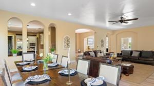 a living room with a table and a couch at Via del Sur by AvantStay Private Spanish Villa w Views Walk to Wineries in Temecula
