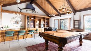 a kitchen with a pool table and a bar at Cathedral by AvantStay Charming Secluded Estate w Sauna Pool Table Views of the Rolling Hills in Paso Robles