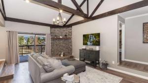 a living room with a couch and a table at Dawn and Dusk by AvantStay Modern Cabin in Great Location w Home Theatre in Big Bear Lake