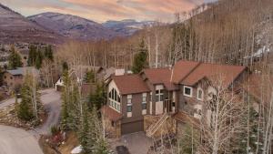 an aerial view of a house in the mountains at Highline by AvantStay Breathtaking Mountain Home w Hot Tub Views in Vail