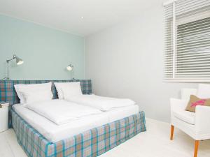 Ένα ή περισσότερα κρεβάτια σε δωμάτιο στο Kaeptn-Cook-4