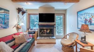 a living room with a couch and a fireplace at Ghostriders 5 by AvantStay 2 Bedroom Condo Near Main Street Hiking Skiing STR permit 3571 in Telluride