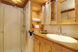 a bathroom with a sink and a shower at Charming village chalet in Saint-Bon-Tarentaise +7 photos