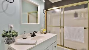 a bathroom with a sink and a shower at Fairway Harbor View by AvantStay Outdoor Oasis in Freeland +44 photos