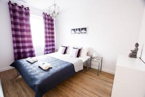 Ένα ή περισσότερα κρεβάτια σε δωμάτιο στο Apartament Słoneczny +26 φωτογραφίες