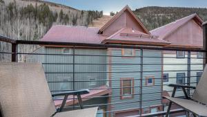 a large building with a metal roof on a balcony at Double Diamond 23 by AvantStay Close to Town The Slopes in Telluride