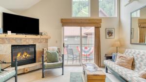 a living room with a fireplace and a tv at Double Diamond 23 by AvantStay Close to Town The Slopes in Telluride
